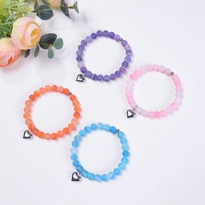 Set of four 8mm natural stone bracelets with heart charms in purple pink and blue colors