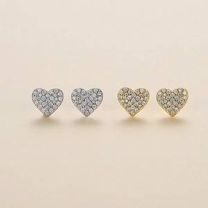 Sparkling pave heart stud earrings in gold and silver finishes with zircon stones