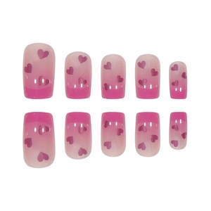 Pink gradient press-on nails set with heart patterns in a square-oval shape