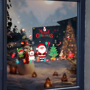 Christmas window stickers with Santa and snowman on a glass pane for festive decoration