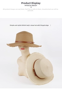 Detail of flat top straw hat with frayed edges and brown leather belt decoration