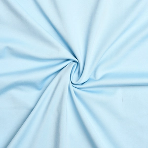 Close-up of soft light blue fabric showing detailed woven texture and elegant folds