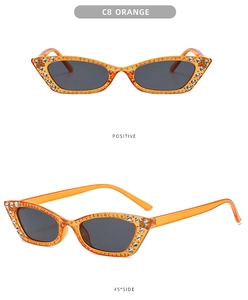 Detailed front and side view of orange cat eye sunglasses with rhinestones and dark lenses