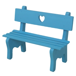 Miniature blue wooden park bench model with heart-shaped cutout on white background