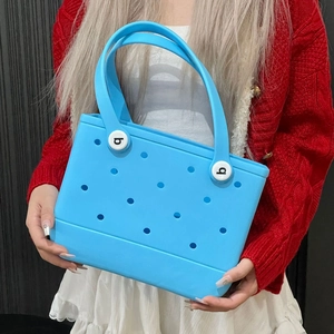 Sky blue EVA waterproof beach tote bag with perforated hole design and sturdy handles