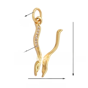 Macro detail of gold-plated pliers charm with white crystals and dimension specs