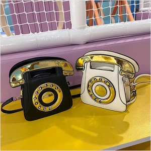 Retro telephone shaped PU leather crossbody bag in black and white with gold finish