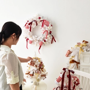 White Nordic Christmas wreath and mini trees set with red and gold ornaments for decor