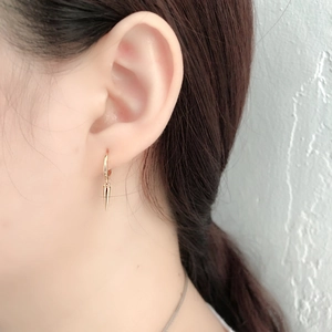 Minimalist gold hoop earrings featuring a sleek metallic cone spike pendant for women