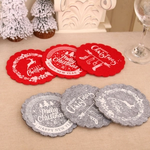 Red and grey felt Christmas coasters with wavy edges and holiday festive typography