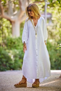 Detail of white cotton linen maxi dress with lantern sleeves and button-down design