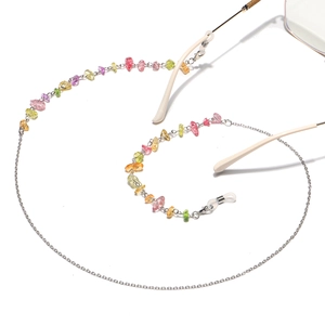 Detail of colorful natural stones and silver chain for glasses and face masks