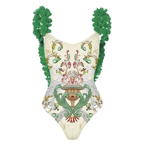 One-piece swimsuit with green floral appliques and baroque print on white background