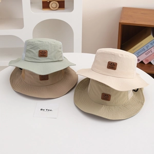Kids quick-dry sun hats in four colors with breathable mesh and smiley face patch