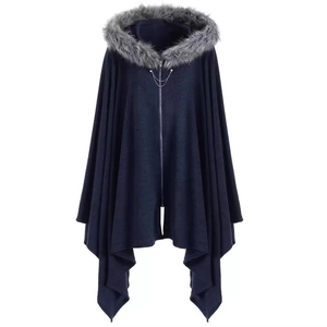 Dark blue hooded knit cloak with faux fur collar and metallic chain zipper detail