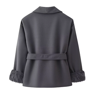 Detail view of dark grey wool coat back with waist belt and grey faux fur trimmed cuffs