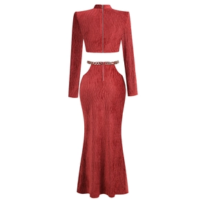 Rear view detail of a dark red pleated two-piece set with long sleeves and metal chain