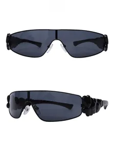 Close-up of Y2K sunglasses featuring unique 3D heart-shaped side decor and sleek dark lenses