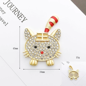 Golden tiger brooch with clear rhinestones and red enamel details, 45mm x 34mm size