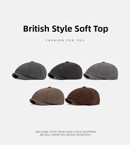 Flat lay of vintage herringbone newsboy caps in five colors including grey and brown