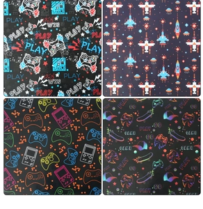 Detail showing four gaming patterns including gamepads and pixel art for party favors