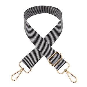 Adjustable black and white striped canvas bag strap with light gold metal swivel hooks