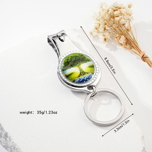 Silver nail clipper keychain with Tree of Life glass dome and product dimensions