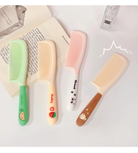 Detail view of cute cartoon hairbrushes featuring watermelon, panda, and bear designs