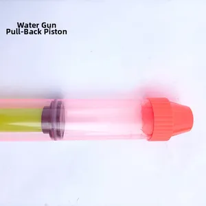 Macro detail of the pull-out piston and orange nozzle of the pink transparent water gun