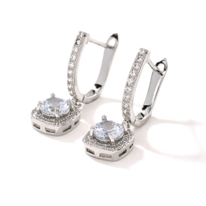 Elegant silver hoop earrings featuring a round clear center stone with micro-paved zircons