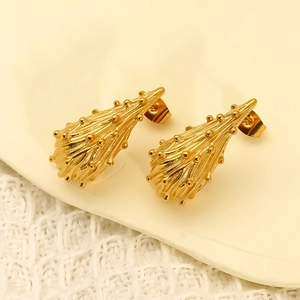 Golden titanium steel teardrop earrings with textured grain finish and cone shape