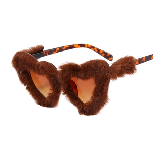 Fashionable heart-shaped sunglasses with brown faux fur trim and tortoiseshell temples