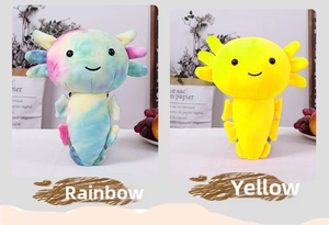 Tie-dye and solid yellow axolotl plush toys in a cozy indoor setting for children