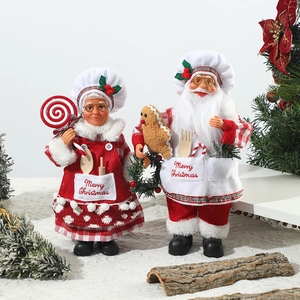 Charming chef Santa Claus and Mrs. Claus figurines for festive restaurant tabletop decoration