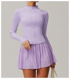 Close-up of lavender sports jacket with high-waisted pleated skirt for yoga and tennis