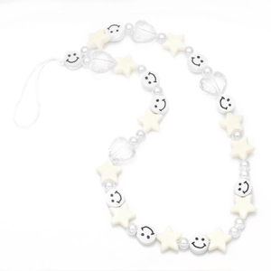 Y2K style beaded phone charm with smiling faces, stars and hearts on white background
