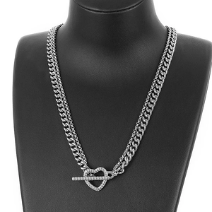 Double layer silver heart toggle necklace with Cuban chain on a display bust