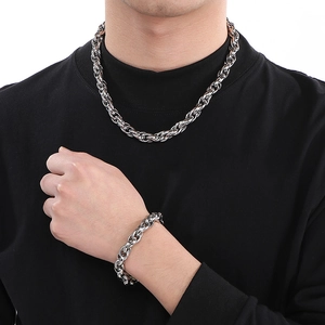 Silver stainless steel twist chain necklace and bracelet set worn on male model