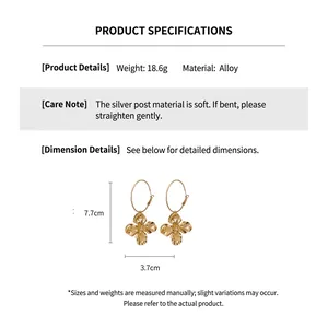 Detailed view of golden flower earrings with size measurements and silver needle material