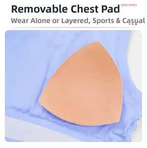 Detail of light blue ribbed sports bra fabric with a removable skin-tone padded insert