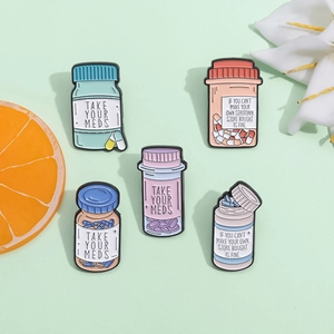 5-piece mental health enamel pin set featuring colorful medicine bottles and quotes