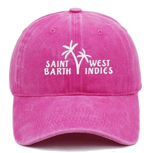 Detail of tropical palm tree embroidery and Saint Barth text on rose red cotton cap