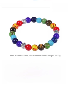 Macro detail of 8mm multicolor yoga energy stone bracelet with silver spacer beads