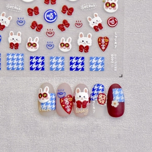Detail of 3D embossed nail stickers with lucky rabbit, bowknot and houndstooth patterns