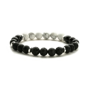 Detailed view of elastic beaded bracelet with tiger eye, onyx, and white turquoise stones