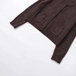 Dark brown knitted cardigan with round neck and gold buttons on a white background