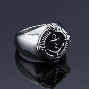 Macro shot of silver stainless steel anchor signet ring with nautical compass details