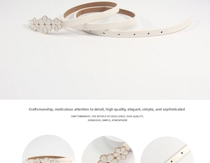 Detail of white flower buckle thin belt with gold accents and adjustable holes for dresses