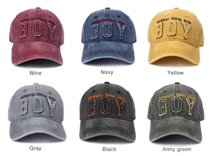 Detailed grid view of washed vintage cotton baseball caps with embroidered BOY patches