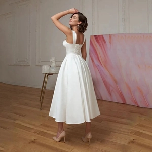 Elegant white satin A-line short wedding dress with a vintage corset tie-back design